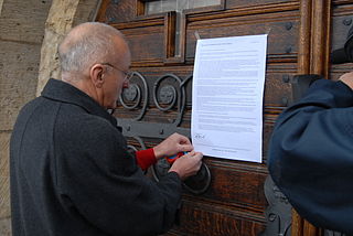 N. Denef przykleja swj list otwarty na drzwiach kocioa w Delitzsch. Wikimedia